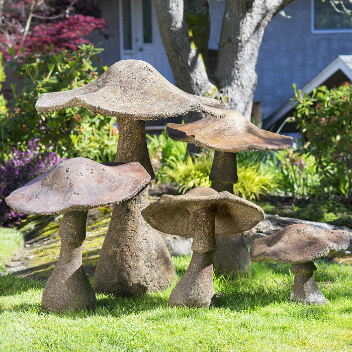 Mushroom Family. Large concrete garden mushroom ornaments.