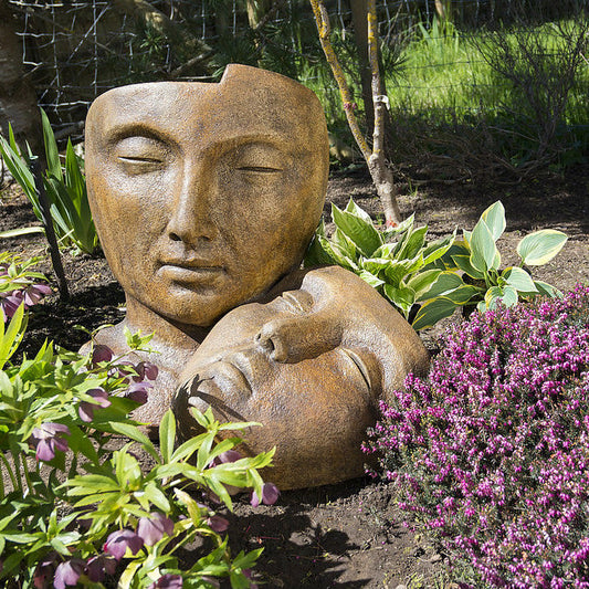 Tranquility Garden Sleeping Faces Statue in Ancient Stone